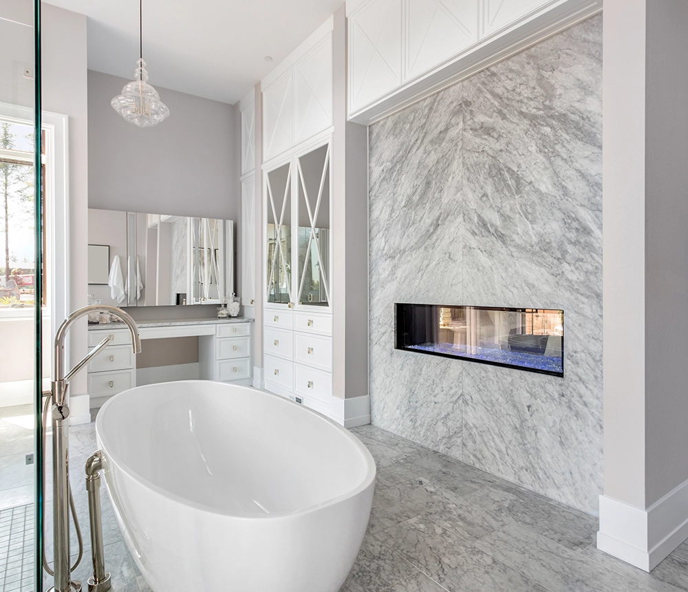 A bathroom with a freestanding tub and a large mirror