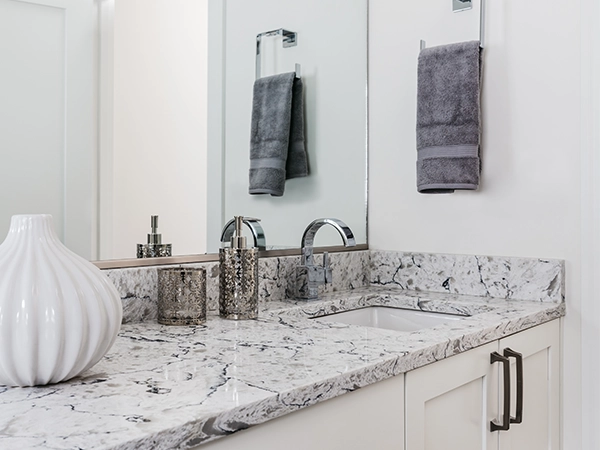 A bathroom countertop made of granite