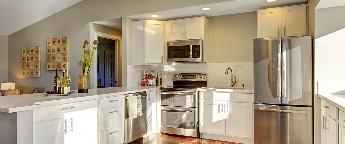 modest white kitchen with appliances