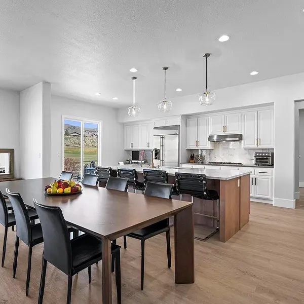 open space kitchen with island and large table