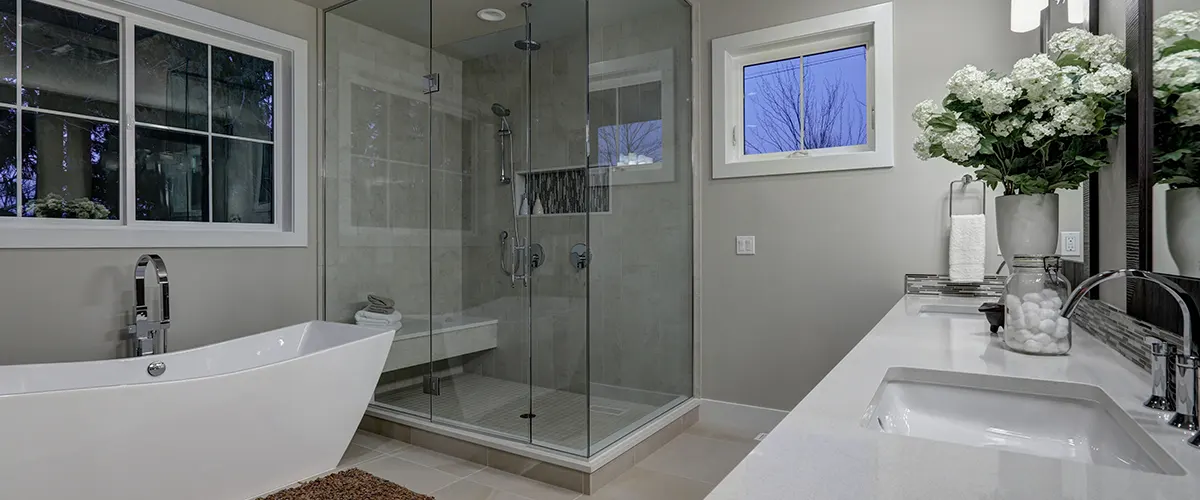 tub and large shower with bench in bathroom
