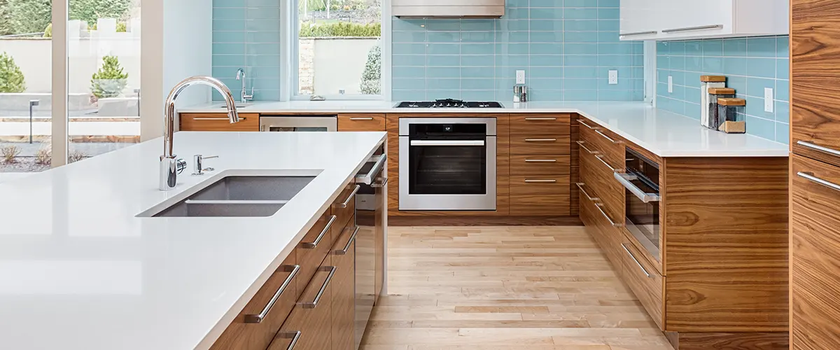 wooden floors in kitchen with blue wall tile