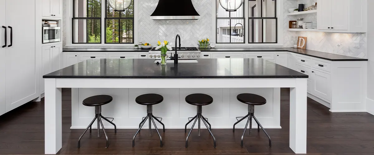 wooden flooring in kitchen with island