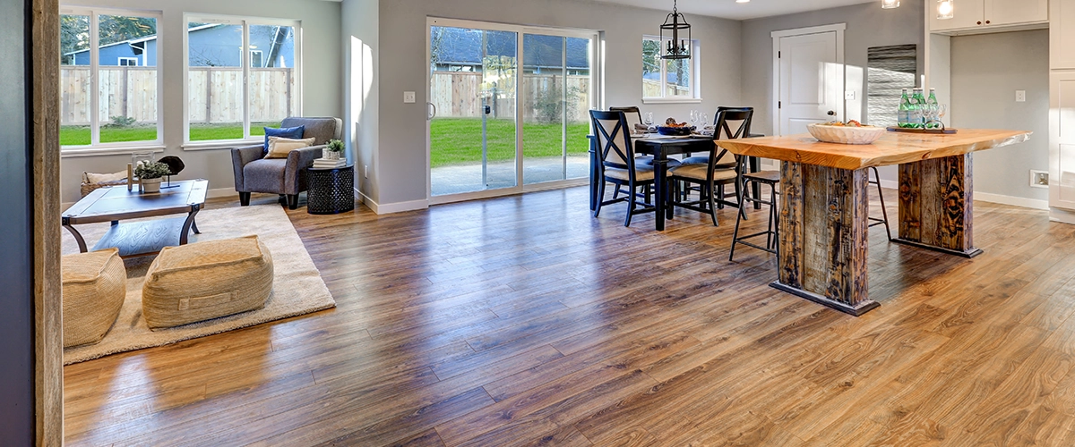 Hardwood floor in kitchen with island and chairs