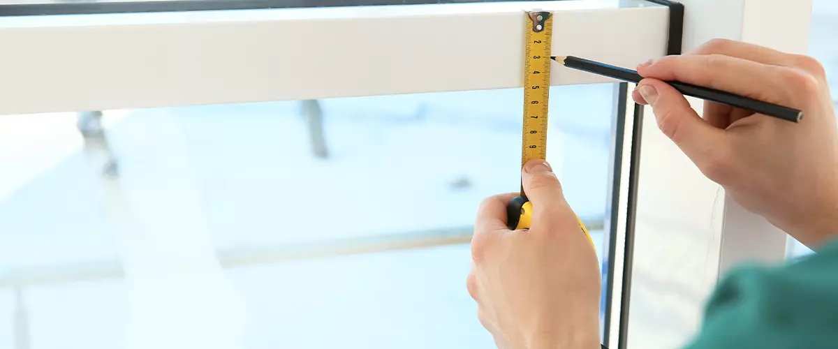 Service man measuring window for installation indoors, closeup