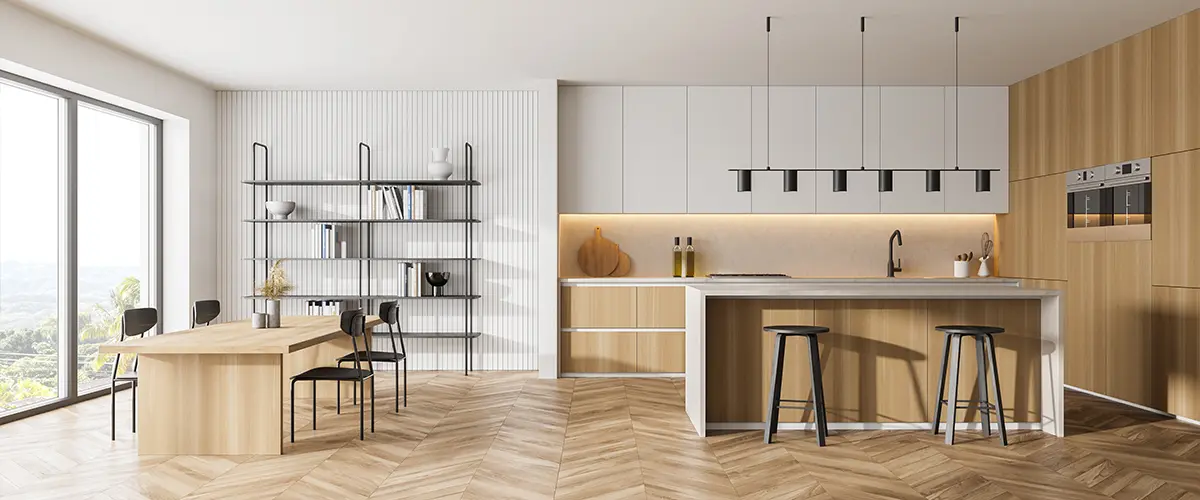 Spacious kitchen with white and wood tones.