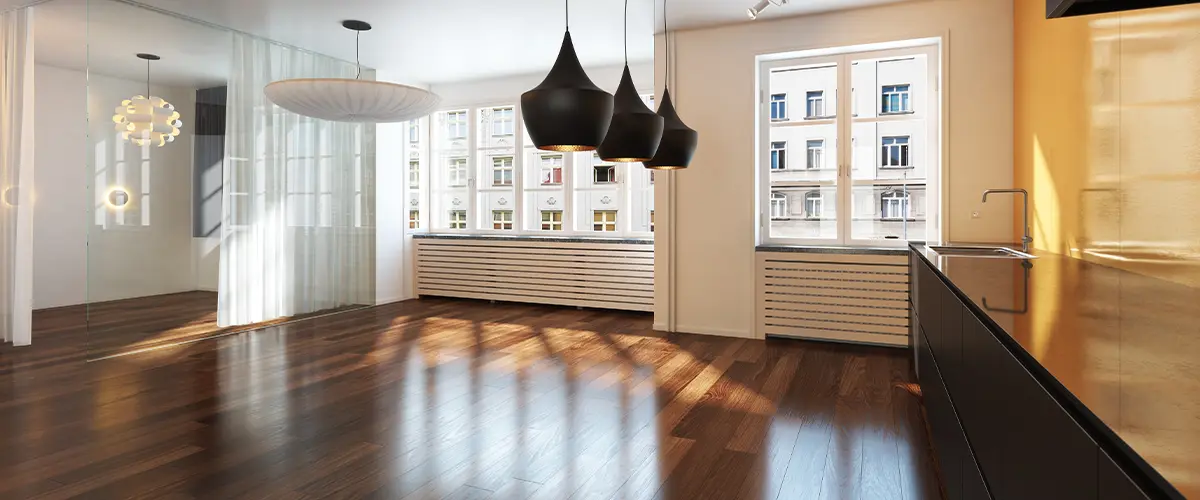 Newly installed hardwood floor in a bright, modern Reno kitchen with stylish lighting.